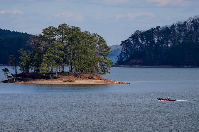 Lake Lanier appears tranquil, but beneath its surface lies a history that makes one uneasy